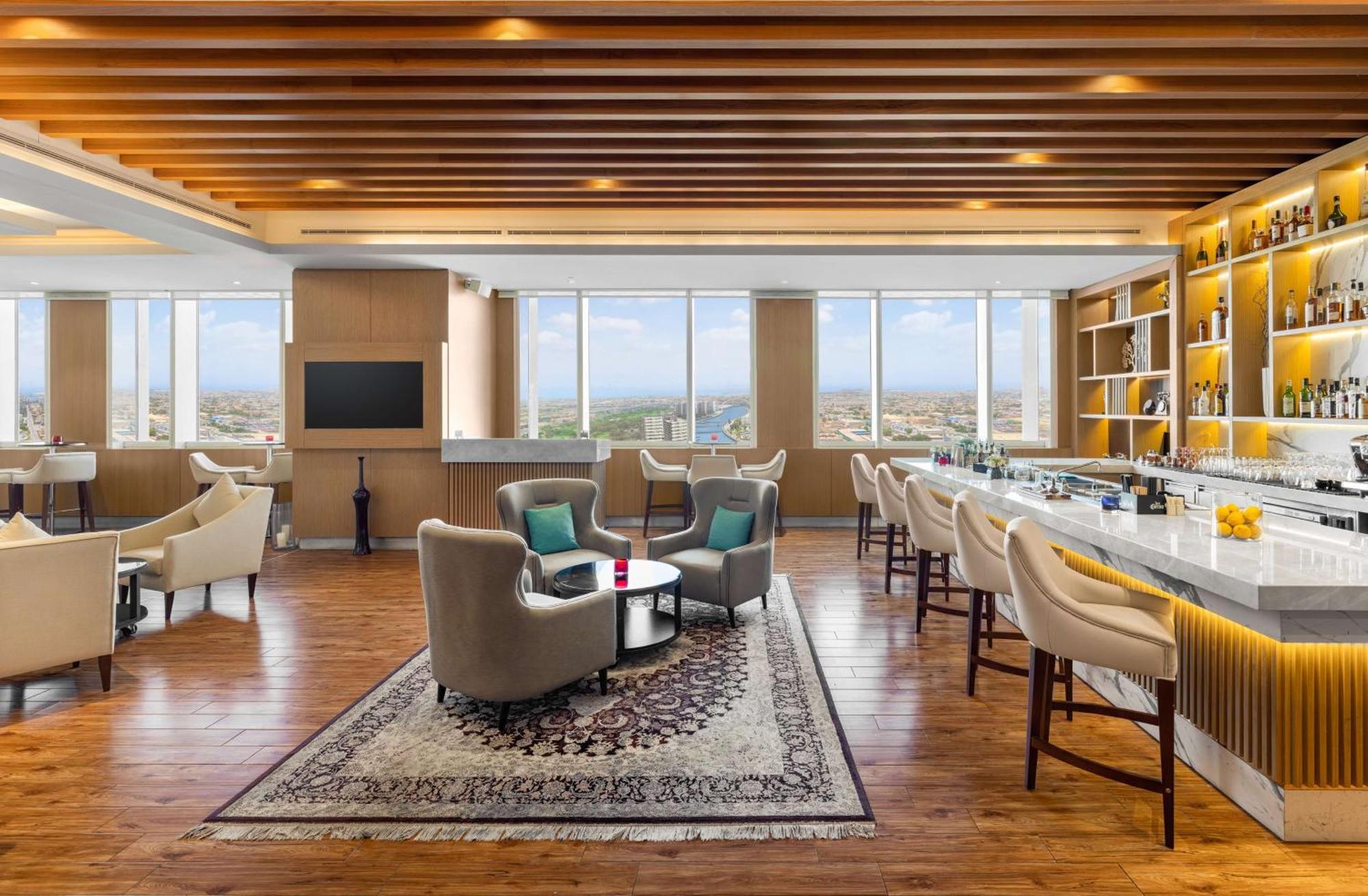 V Hotel Dubai, Curio Collection By Hilton Екстер'єр фото The Club Lounge at the hotel