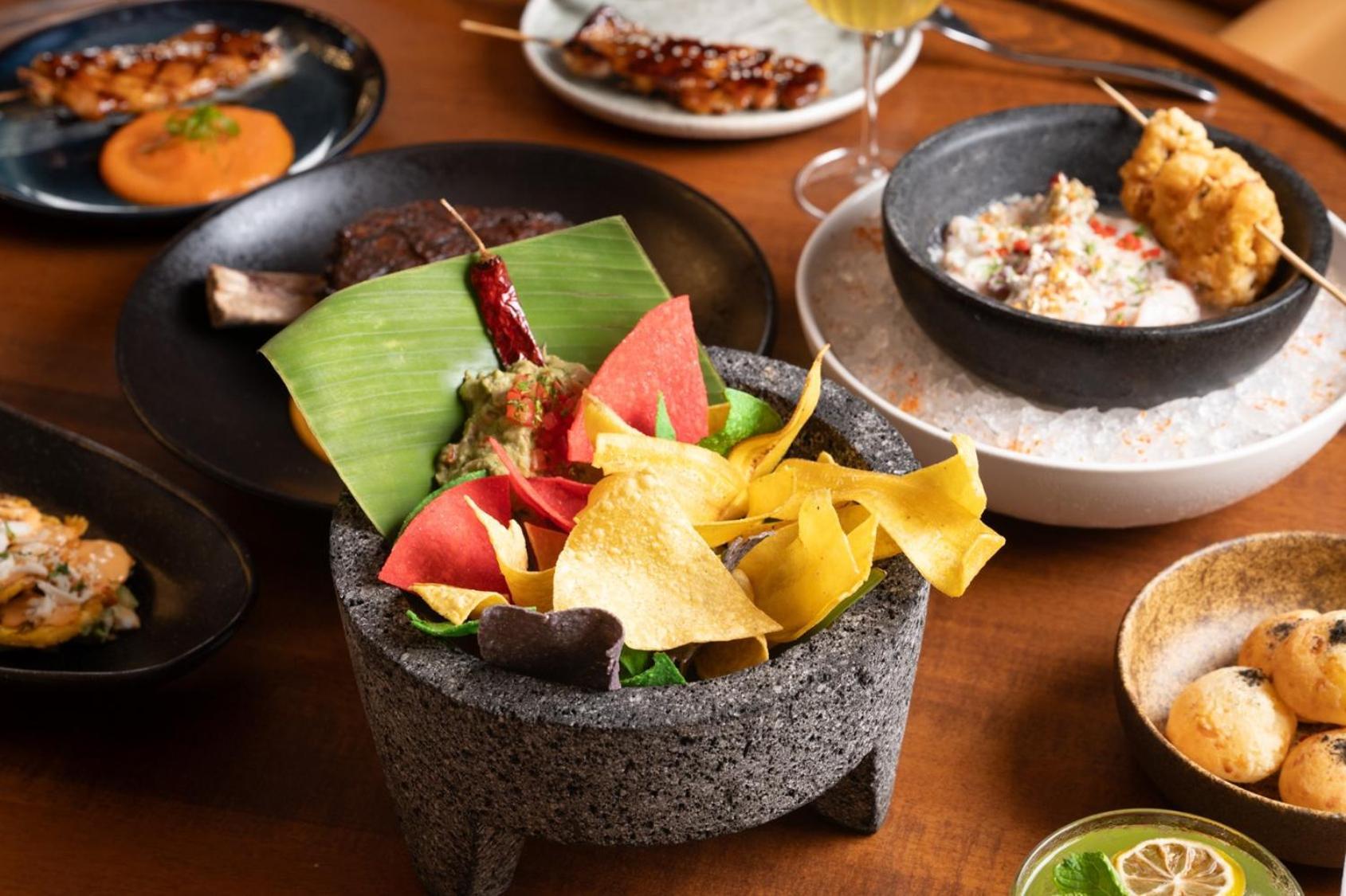 V Hotel Dubai, Curio Collection By Hilton Екстер'єр фото A selection of dishes at the restaurant
